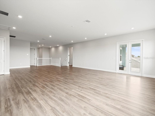 unfurnished living room featuring light hardwood / wood-style floors