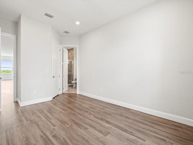 spare room with light wood-type flooring