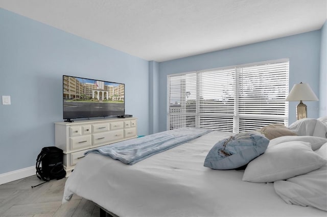 bedroom featuring light parquet floors