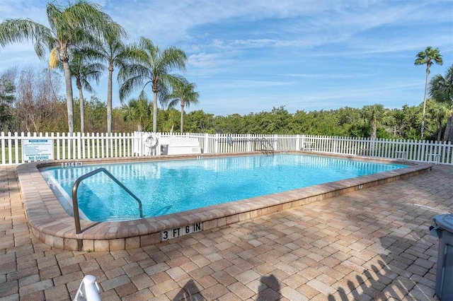 view of swimming pool featuring a patio