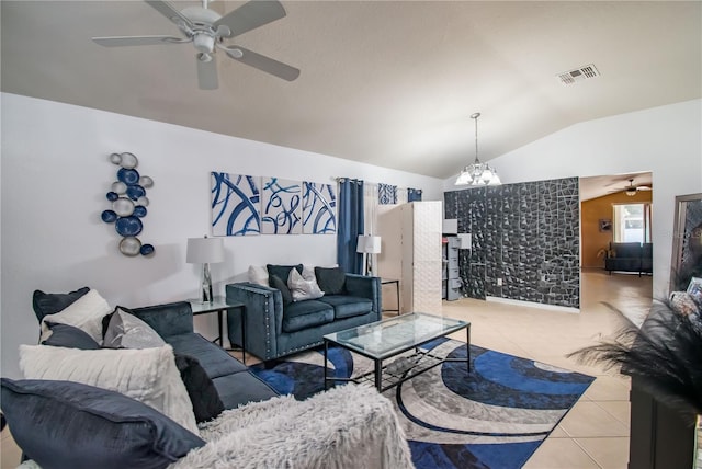 tiled living room with vaulted ceiling and ceiling fan with notable chandelier