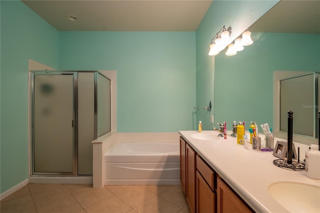 bathroom with tile patterned flooring, vanity, and plus walk in shower