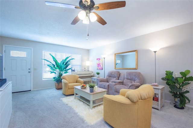 living room with ceiling fan and light colored carpet