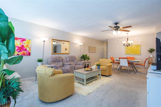 carpeted living room featuring ceiling fan with notable chandelier and a textured ceiling