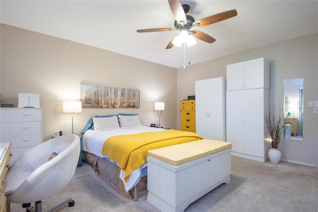 bedroom featuring ceiling fan and light colored carpet