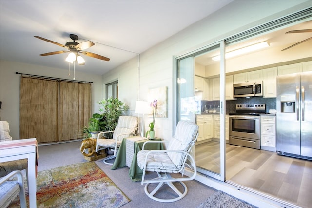 interior space with light hardwood / wood-style floors and ceiling fan