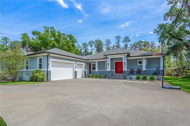 view of front of house with a garage and a porch