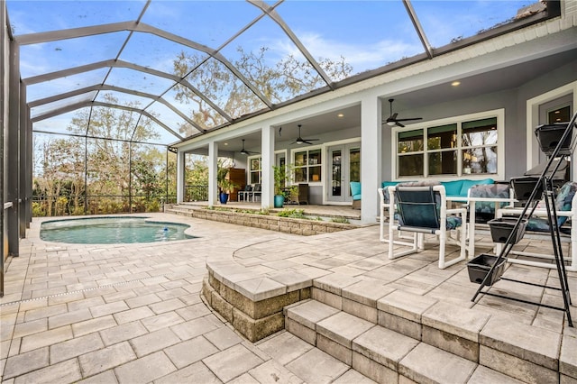 outdoor pool with ceiling fan, a patio, and a lanai