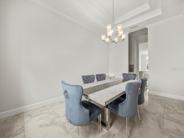 dining area with a raised ceiling, an inviting chandelier, and crown molding