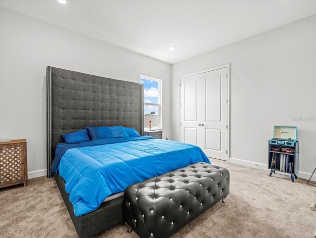 carpeted bedroom with a closet