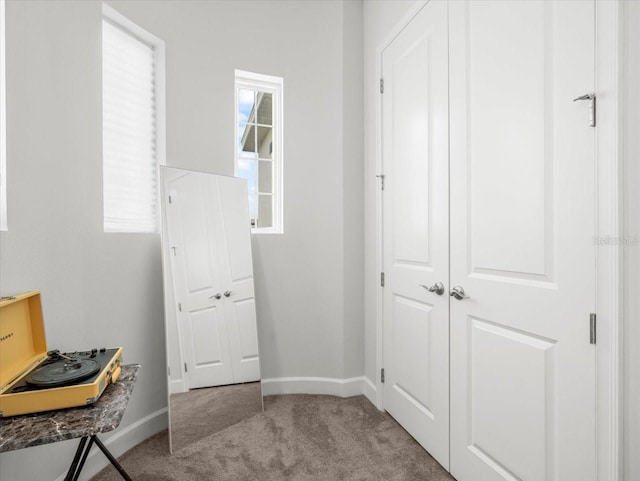 interior space featuring light colored carpet