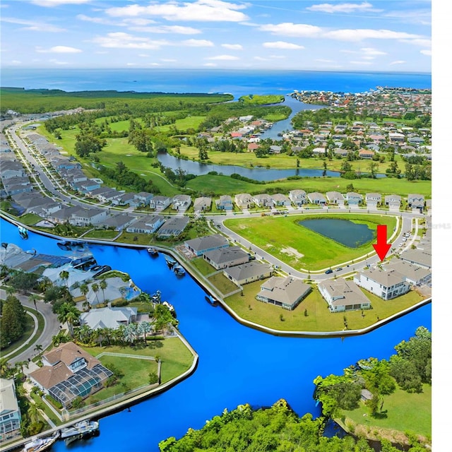 birds eye view of property featuring a water view