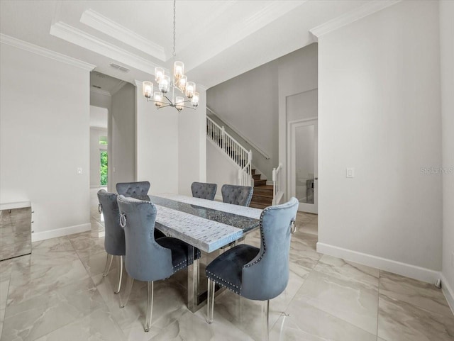 dining room featuring a tray ceiling, a chandelier, and ornamental molding