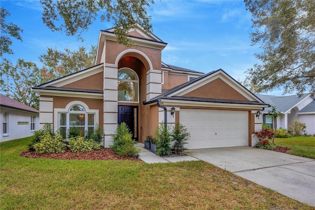 view of front of house featuring a front yard and a garage