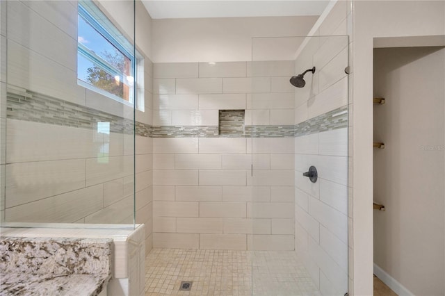 bathroom featuring tiled shower