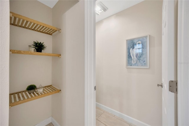 corridor with light tile patterned floors