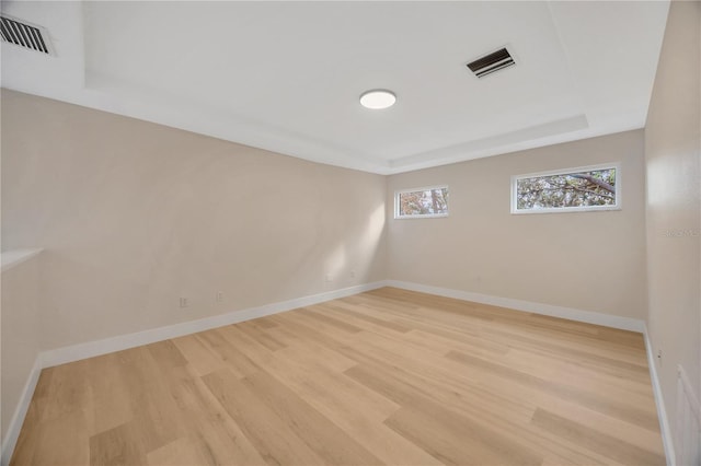 unfurnished room featuring light hardwood / wood-style floors