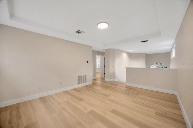 spare room featuring light hardwood / wood-style flooring