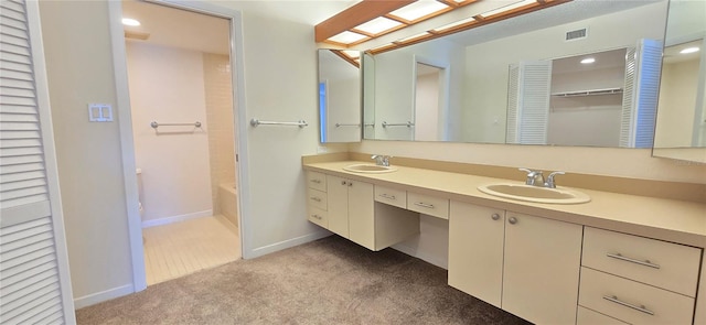 bathroom featuring bathtub / shower combination and vanity