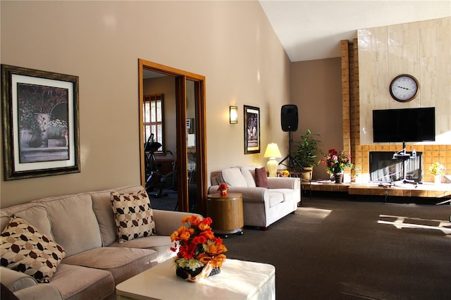 carpeted living room featuring a fireplace and lofted ceiling