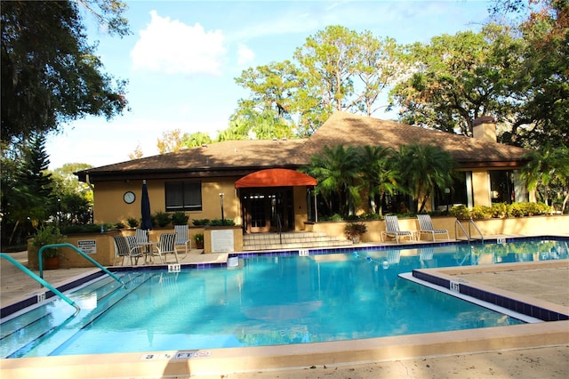 view of pool featuring a patio