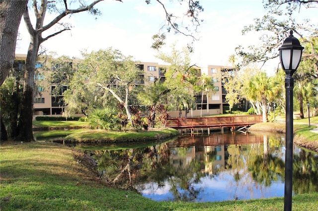 view of home's community with a water view