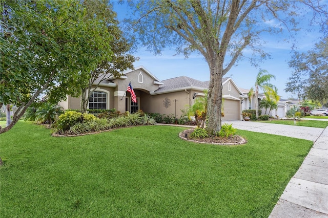 view of front of property with a garage and a front lawn