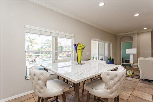 tiled dining room with crown molding