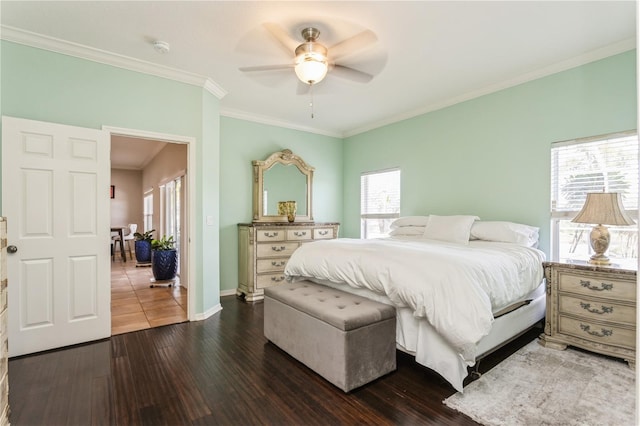 bedroom with ceiling fan, crown molding, and dark hardwood / wood-style floors