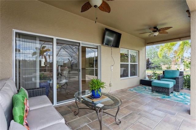 view of patio with outdoor lounge area and ceiling fan