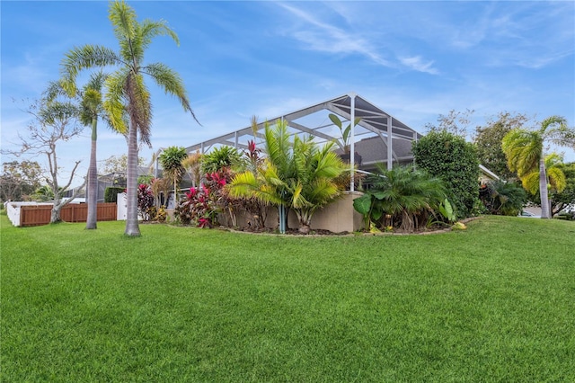 view of yard featuring glass enclosure