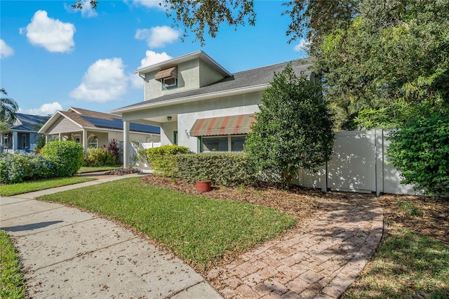 view of front of property with a front lawn