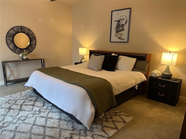 carpeted bedroom featuring baseboards