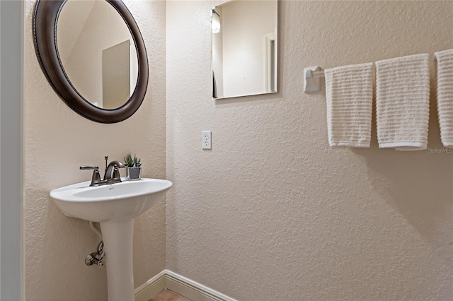 bathroom with a textured wall