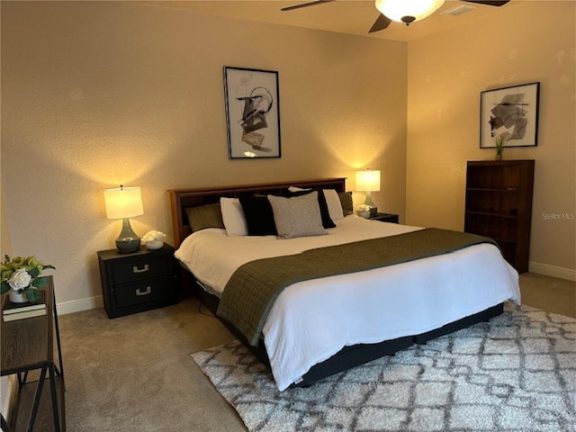 carpeted bedroom featuring a ceiling fan and baseboards