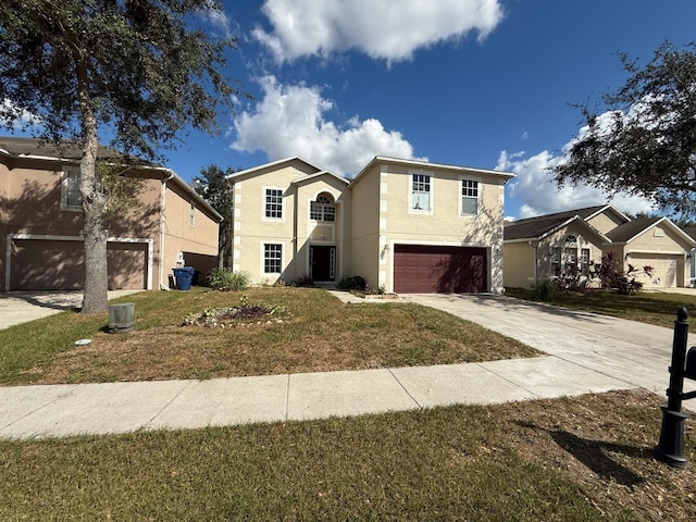 view of front facade featuring a front yard and a garage