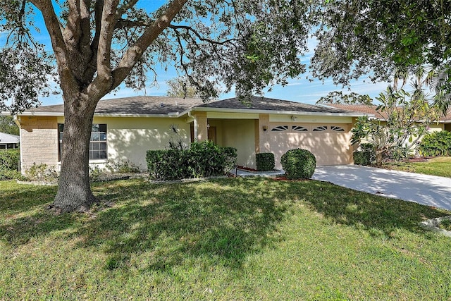 ranch-style home with a garage and a front lawn