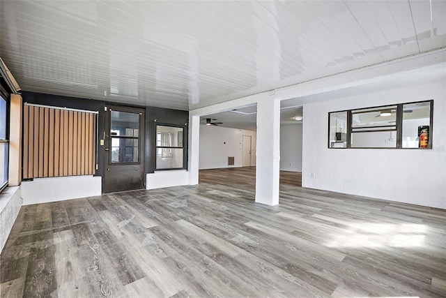 interior space with hardwood / wood-style flooring and ceiling fan