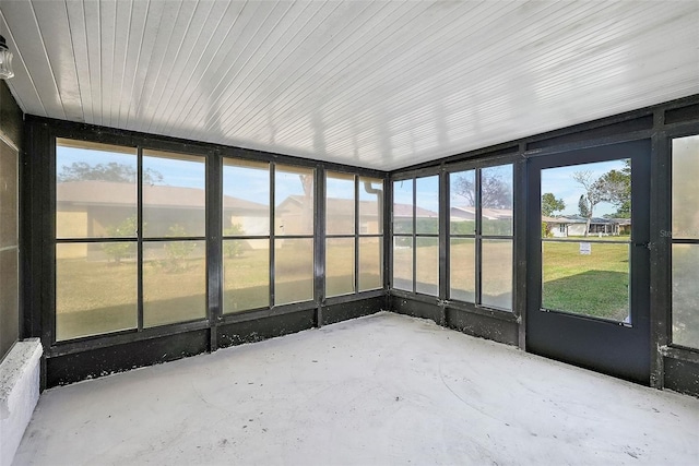 unfurnished sunroom featuring a mountain view and plenty of natural light