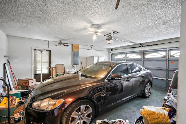 garage featuring ceiling fan and electric panel