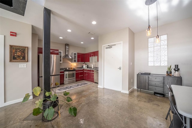 kitchen featuring recessed lighting, stainless steel appliances, baseboards, dark brown cabinets, and wall chimney range hood