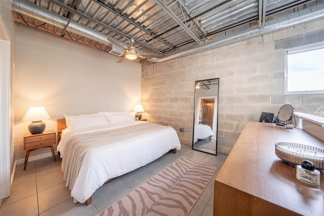 bedroom with concrete block wall