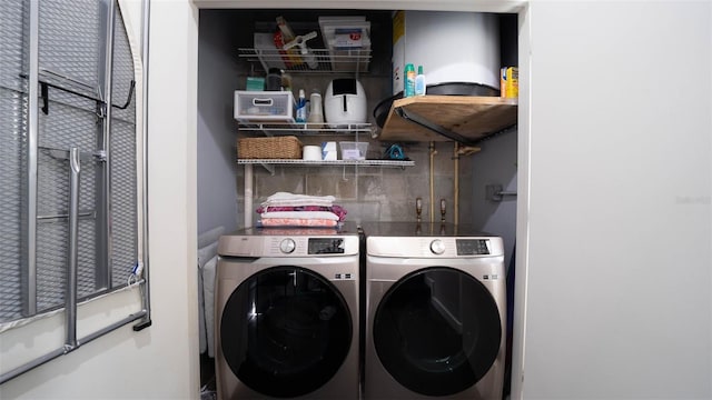 washroom with laundry area and washing machine and dryer