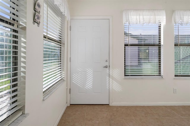 doorway featuring light tile patterned floors