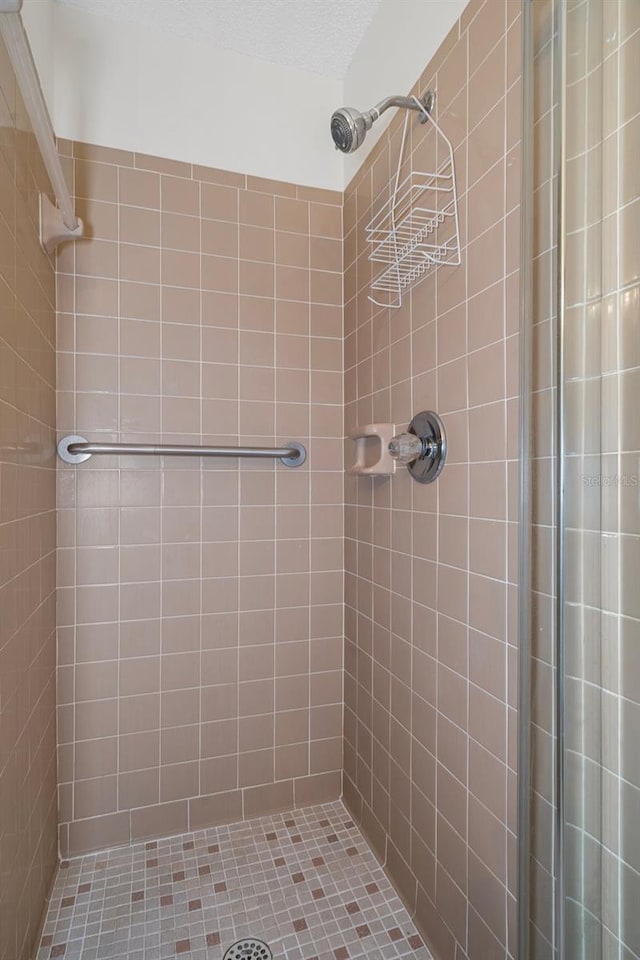 bathroom with a tile shower