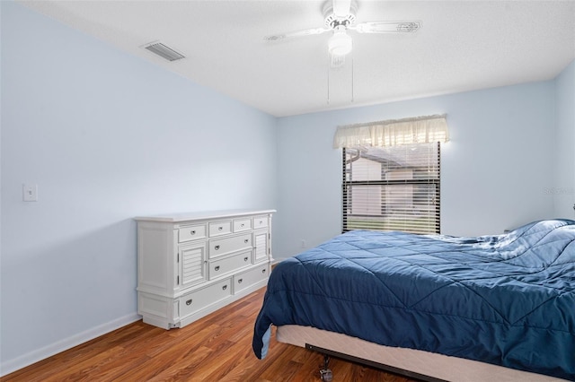 bedroom featuring ceiling fan and light hardwood / wood-style floors