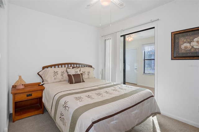 carpeted bedroom featuring ceiling fan