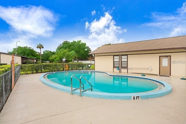 view of pool featuring a patio area