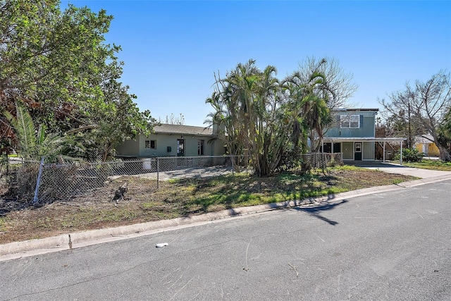 view of front of property featuring a carport