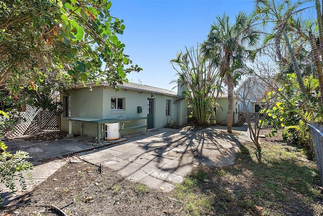 rear view of property featuring a patio